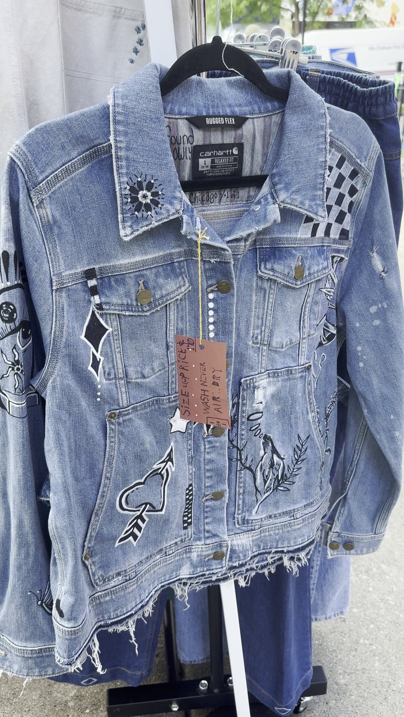 Altered denim jacket detail with tag