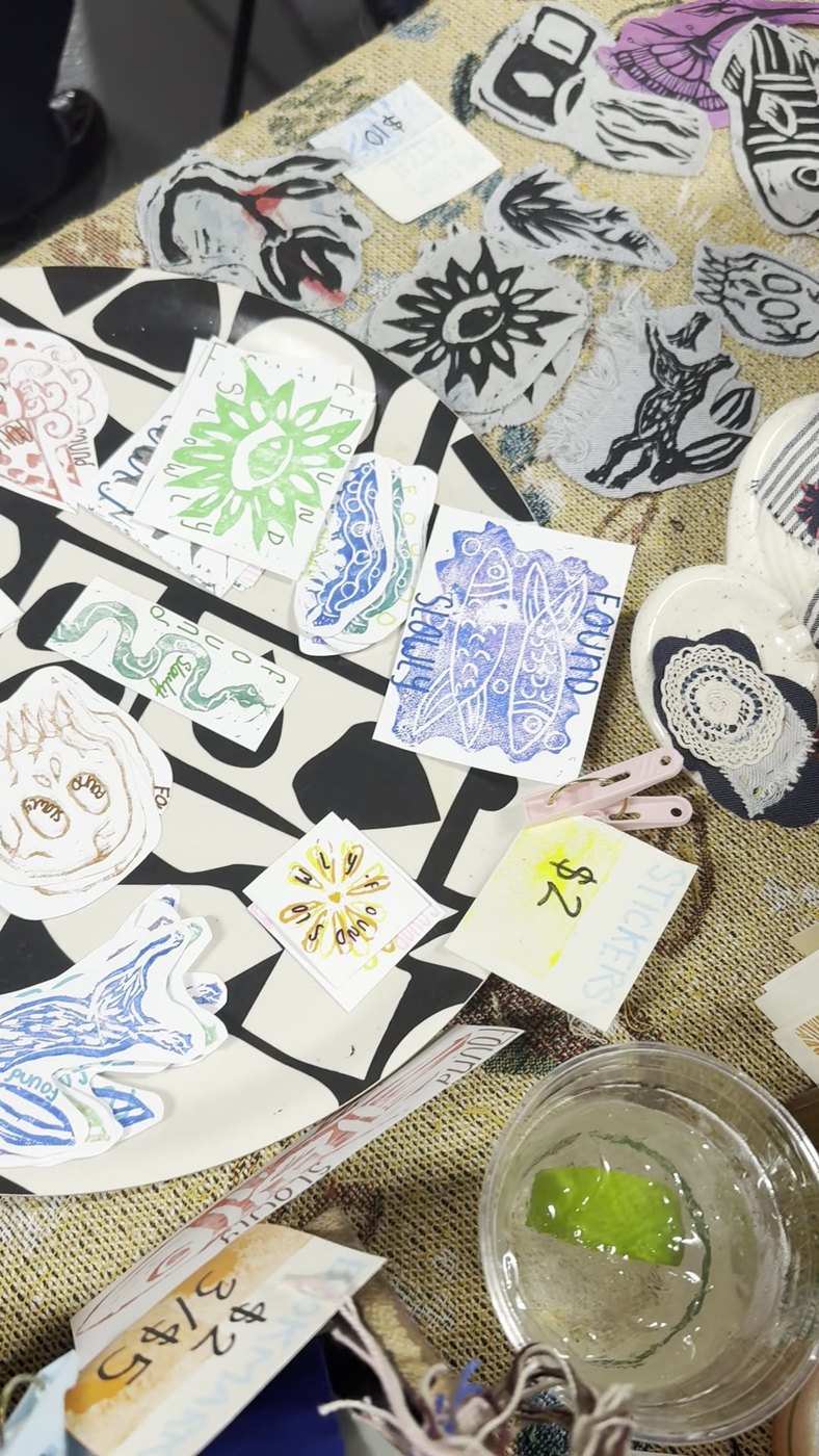Block print patches and hand tags on a market table